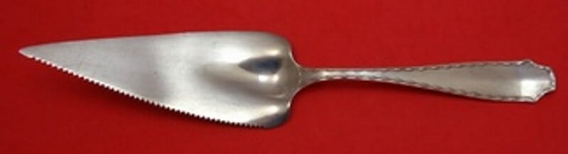 Tiffany & Co Marquise Sterling Silver Serrated Pie Server 11 3/8": Tiffany & Co Marquise Sterling Silver Serrated Pie Server 11 3/8" This exquisite pie server from Tiffany & Co. is crafted in sterling silver and showcases the elegant Marquise pattern. Measuring 11 3/
