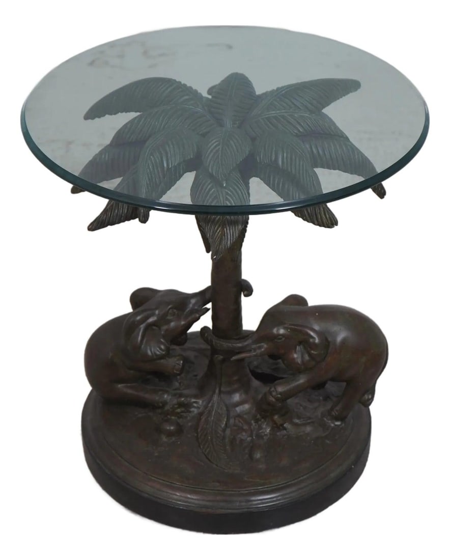 Bronze Finish Composite Elephant Table with Glass Top 23x23x24.5 Inch: Bronze Finish Composite Elephant Table with Glass Top 23x23x24.5 Inch This occasional table features a glass top supported by an elephant base crafted from composite material with a bronze finish. The