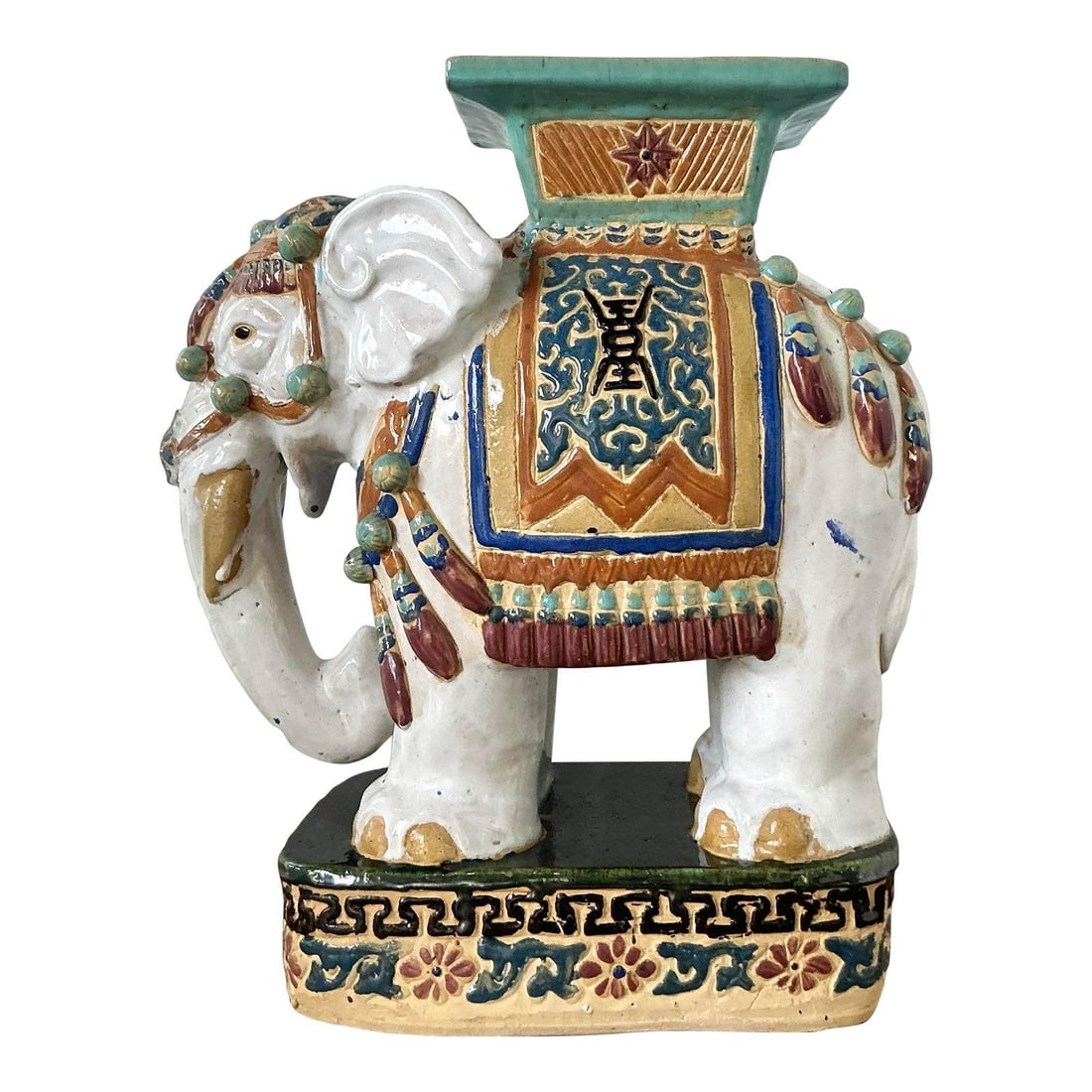 Chinoiserie Ceramic Elephant Garden Stool in Sancai Glaze Boho Accent: Chinoiserie Ceramic Elephant Garden Stool in Sancai Glaze Boho Accent This vintage Boho glazed ceramic elephant stool showcases a hand-crafted white elephant with an ornate saddle and headdress in a v