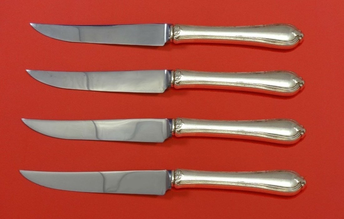 Towle Old Newbury Sterling Silver Steak Knife Set 4pc Custom 8.5": Towle Old Newbury Sterling Silver Steak Knife Set 4pc Custom 8.5" Enhance your dining experience with this exquisite 4-piece steak knife set from the renowned Old Newbury pattern by Towle. Crafted fro
