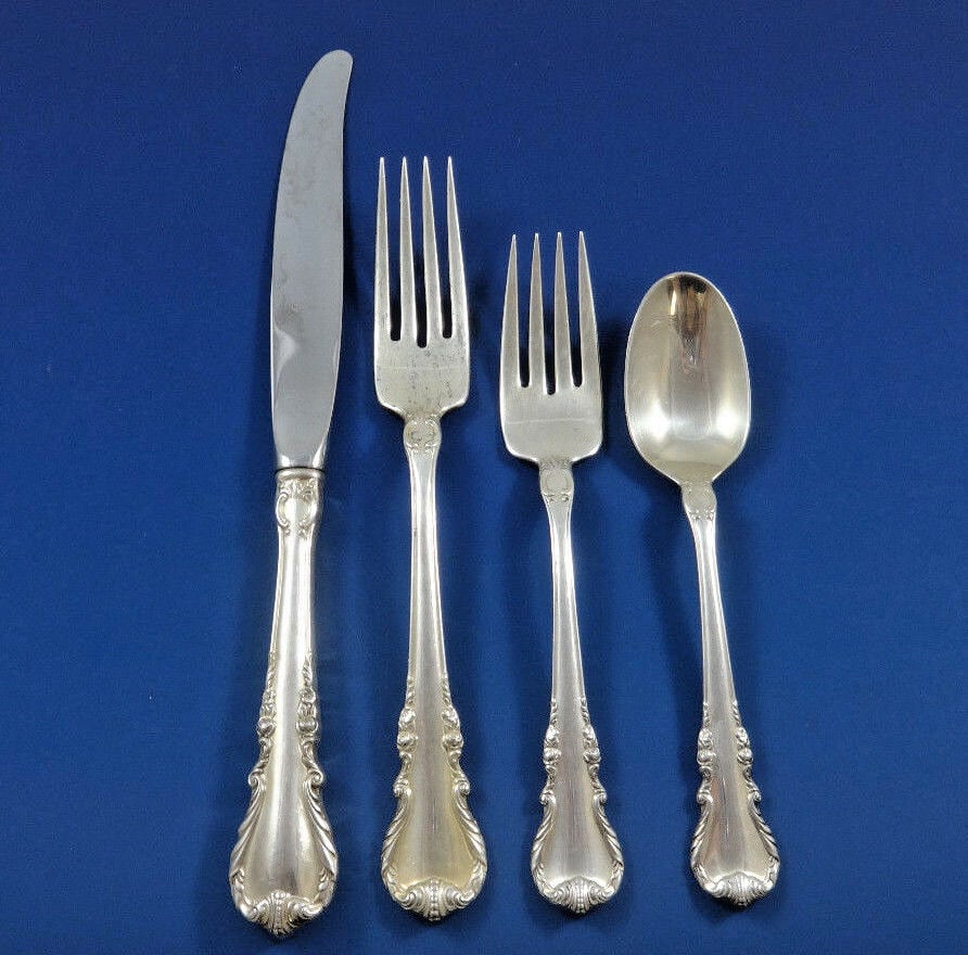 Wallace Melanie Sterling Silver 4-Piece Dinner Place Setting: Wallace Melanie Sterling Silver 4-Piece Dinner Place Setting Elevate your dining experience with this exquisite 4-piece dinner size place setting from the Melanie pattern by Wallace. Crafted from high