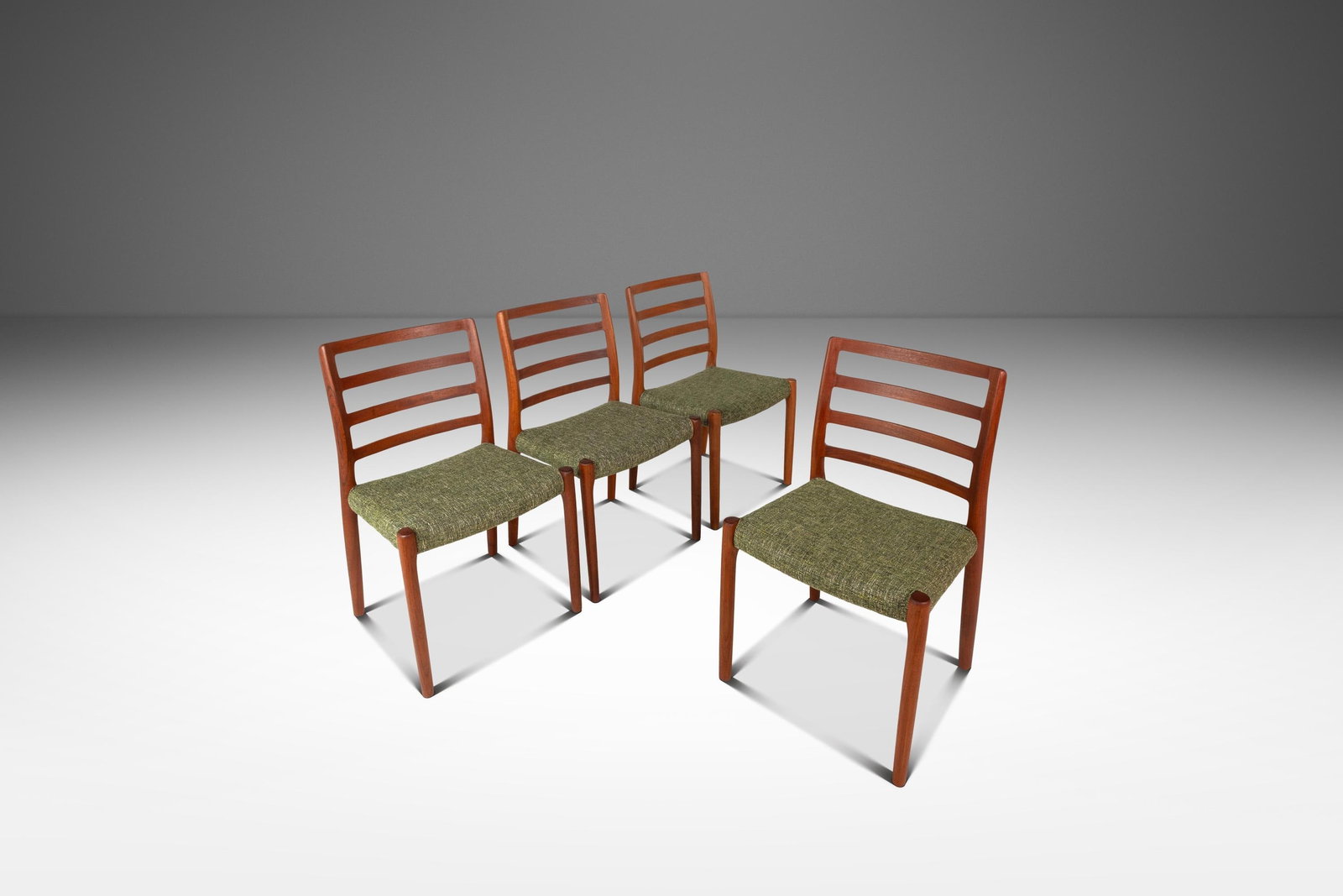 Restored Set of 4 Niels Moller Model 85 Teak Dining Chairs: Restored Set of 4 Niels Moller Model 85 Teak Dining Chairs This exquisite set of four Danish Mid-Century Modern Model 85 ladderback dining chairs, designed by the renowned Niels Moller for J.L. Moller
