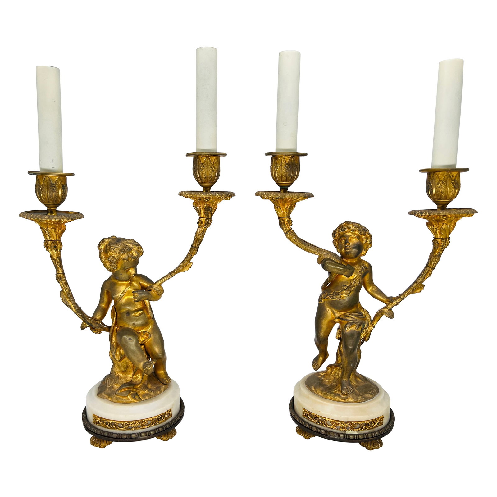 Electrified Pair of Gilt Bronze Louis XVI Style Putti Candlestick Lamps: Electrified Pair of Gilt Bronze Louis XVI Style Putti Candlestick Lamps This exquisite pair of gilt bronze candlestick lamps captures the elegance of the Louis XVI style and the charm of the Italian R