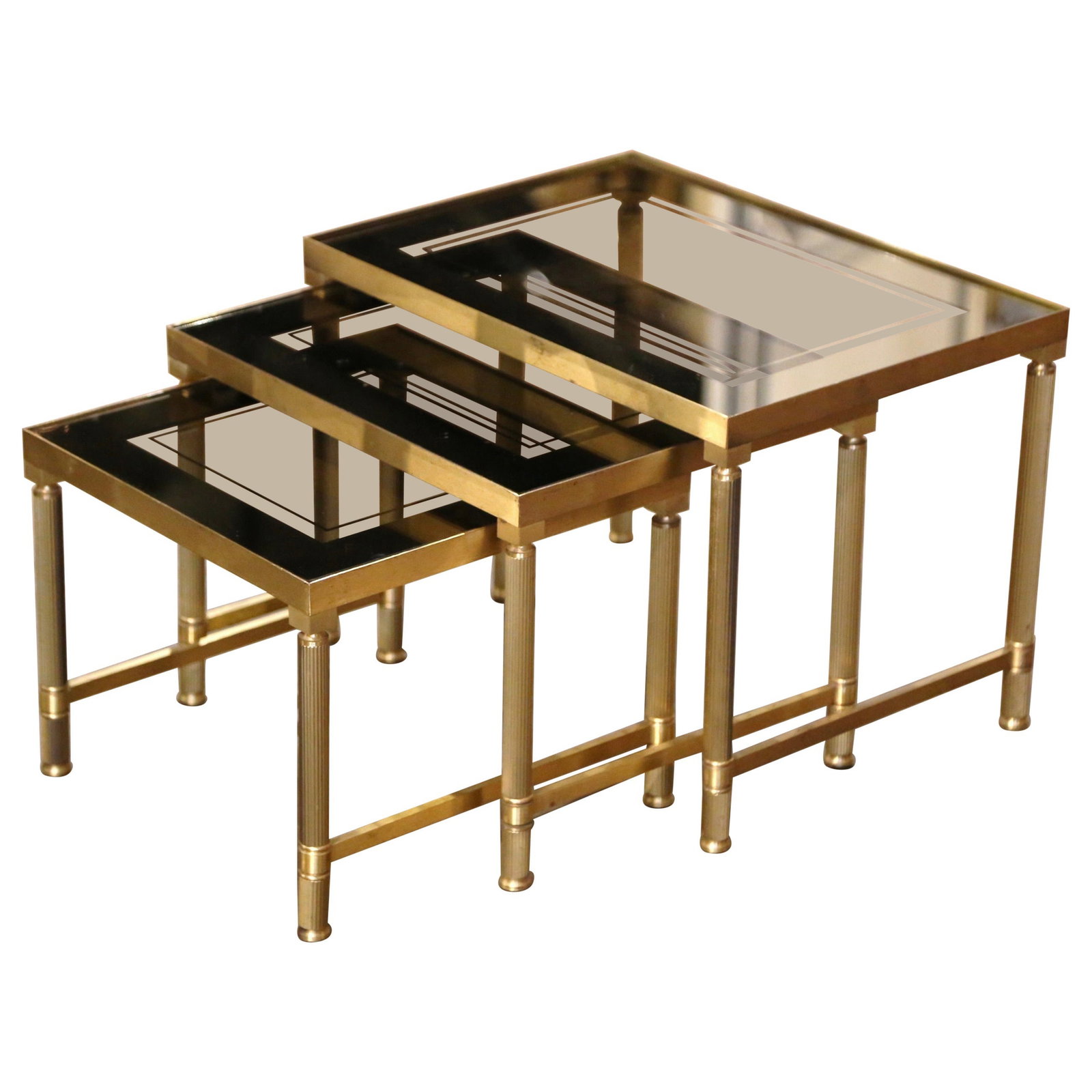 Trio of French Brass and Glass Nesting Tables in Bagues Style: Trio of French Brass and Glass Nesting Tables in Bagues Style This set of three mid-century French nesting tables features the elegant Bagues style from circa 1960. Each table is hand-crafted with bra
