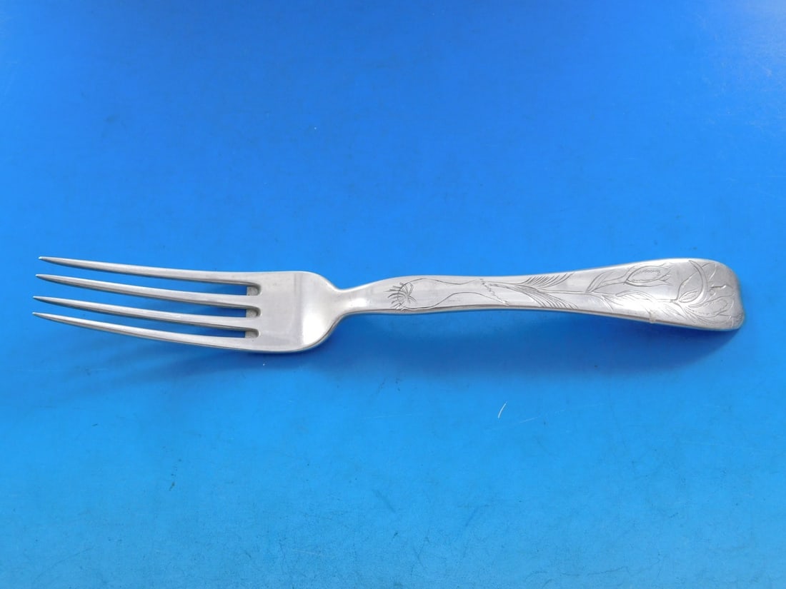 Tiffany & Co Lap Over Edge Sterling Silver Fork 7 1/4 Inch Floral Motif: Tiffany & Co Lap Over Edge Sterling Silver Fork 7 1/4 Inch Floral Motif This exquisite sterling silver fork is a stunning example of Tiffany & Co.'s craftsmanship from the 19th century. Featuring the 