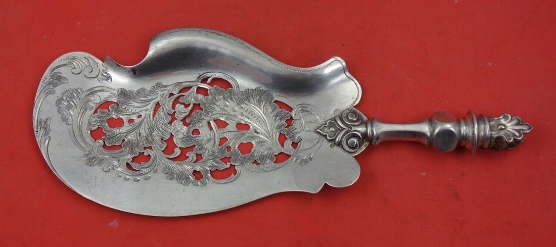 Dutch Sterling Fish Server .833 Silver Blade 10 1/4 Inch: Dutch Sterling Fish Server .833 Silver Blade 10 1/4 Inch This exquisite Dutch Sterling fish server features a .833 silver blade measuring 10 1/4 inches. The design showcases beautifully pierced brite-