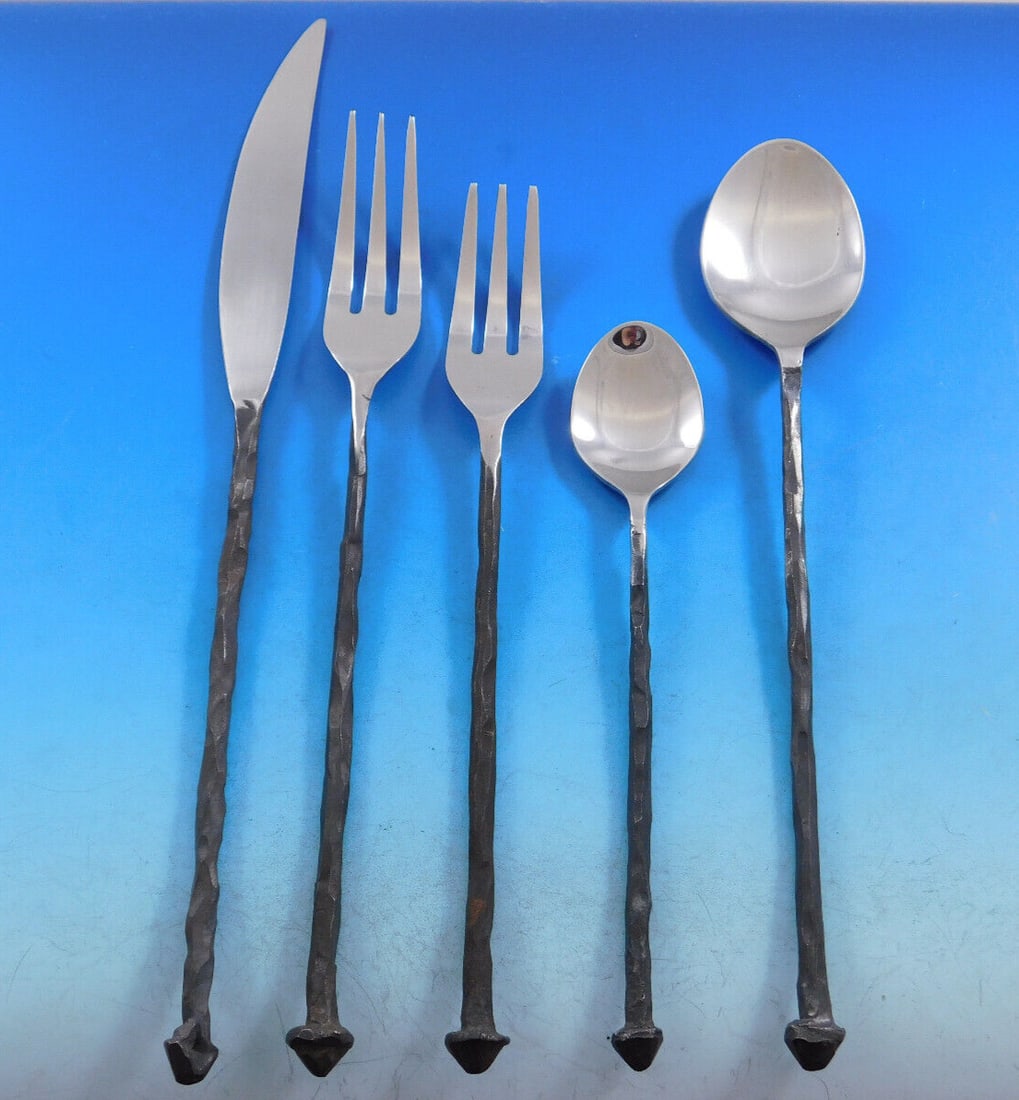Michael Aram Iron Age Black Oxidized Stainless Steel Flatware Set 31 pcs: Michael Aram Iron Age Black Oxidized Stainless Steel Flatware Set 31 pcs Discover the elegance of the Iron Age Black Oxidized Stainless Steel Flatware Set designed by Michael Aram. This 31-piece colle