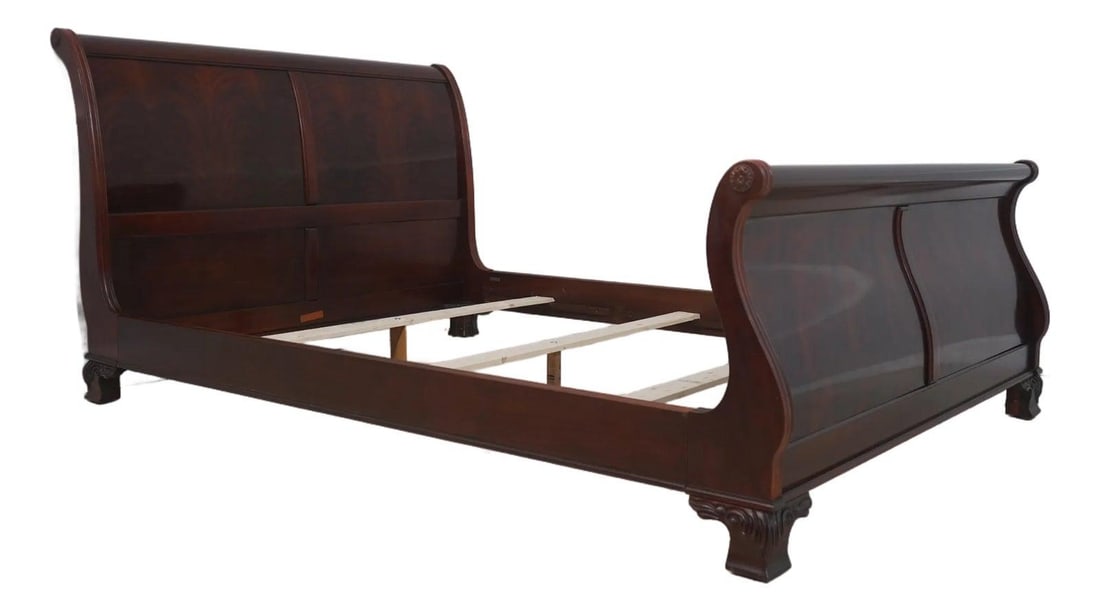 Queen Sleigh Bed in Flame Mahogany with Carved Details: Queen Sleigh Bed in Flame Mahogany with Carved Details This queen size sleigh bed features a classic traditional design crafted from rich, figural flame mahogany. The bed showcases carved bracket feet