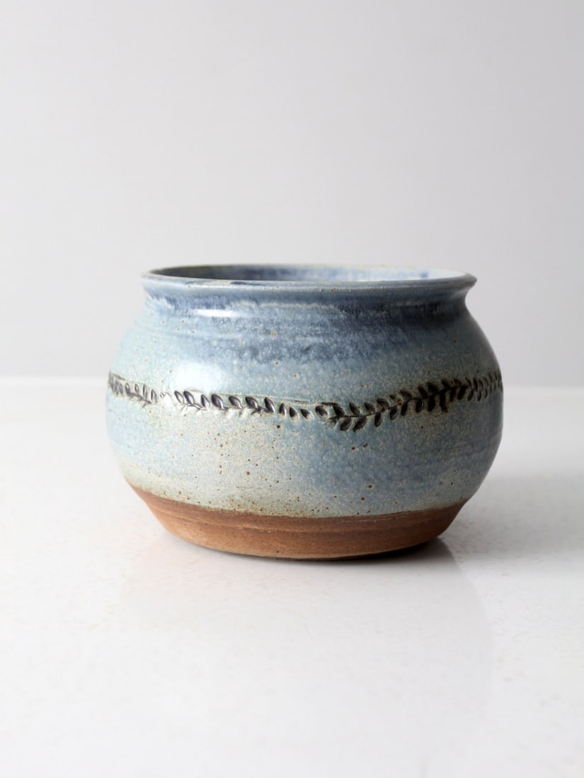 Signed Vintage Studio Pottery Jardiniere with Blue Glaze and Etched Foliage: Signed Vintage Studio Pottery Jardiniere with Blue Glaze and Etched Foliage This vintage studio pottery jardiniere showcases the artistry of its maker with a stunning blue washed glaze and an intricat