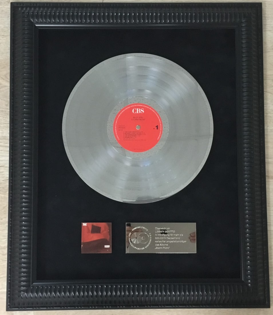 Billy Joel Platinum Record Award Custom Framed Liberty Devitto Drummer: Billy Joel Platinum Record Award Custom Framed Liberty Devitto Drummer Celebrate the legacy of Billy Joel with this stunning original platinum record award for the album 'Storm Front.' Expertly custom
