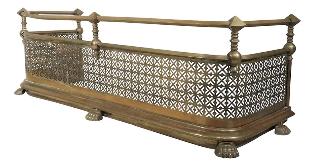 Victorian Era Brass Fireplace Fender with Diamond Finials and Paw Feet: Victorian Era Brass Fireplace Fender with Diamond Finials and Paw Feet This antique Victorian fireplace fender showcases aesthetic movement style with a reticulated brass front, animal paw feet, and a