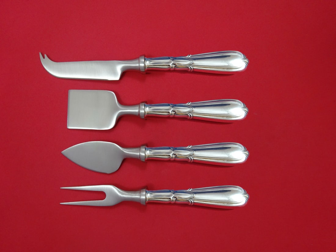 Frank Whiting Troubadour Sterling Silver Cheese Set 4pc: Frank Whiting Troubadour Sterling Silver Cheese Set 4pc This exquisite cheese serving set, crafted by Frank M. Whiting, features a stunning Troubadour pattern. Made of sterling silver with hollow hand