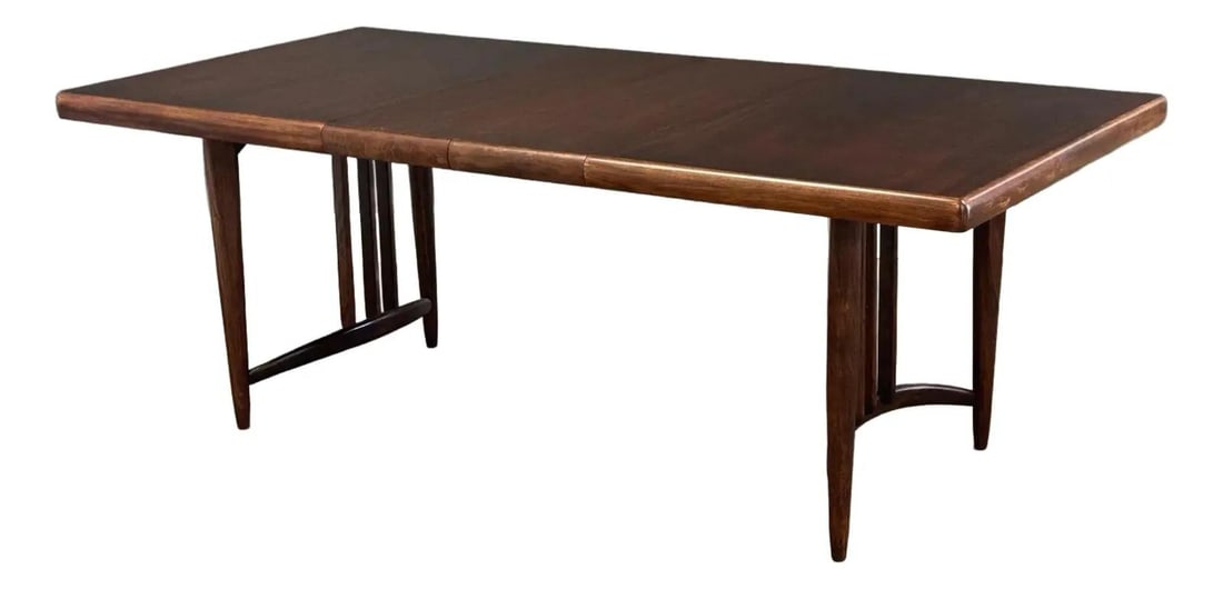 1960s Mahogany Dining Table with Three 12 Inch Leaves: 1960s Mahogany Dining Table with Three 12 Inch Leaves This exquisite mid-century modern dining table is expertly crafted from mahogany and features three 12-inch leaves, allowing it to extend fully to