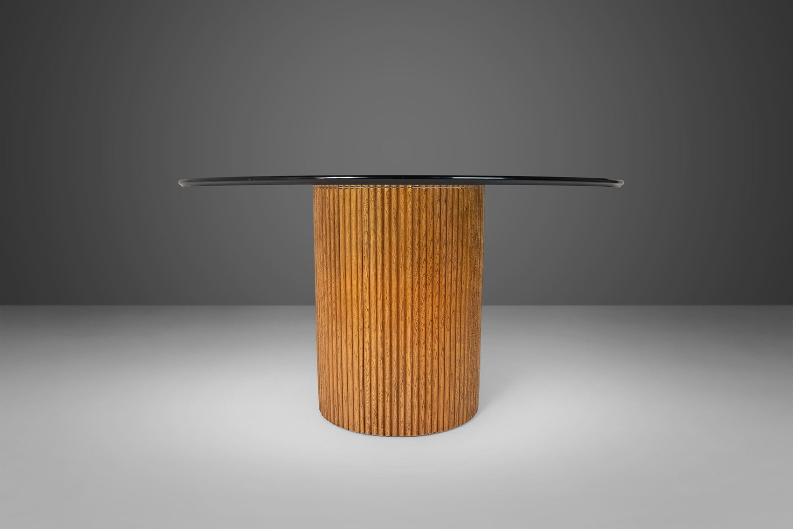 1970s Bamboo Pedestal Dining Table with Mirrored Glass Top: 1970s Bamboo Pedestal Dining Table with Mirrored Glass Top This exquisite bamboo pedestal dining table features a stunning mirrored top and a round beveled glass surface, embodying the charm of the 19