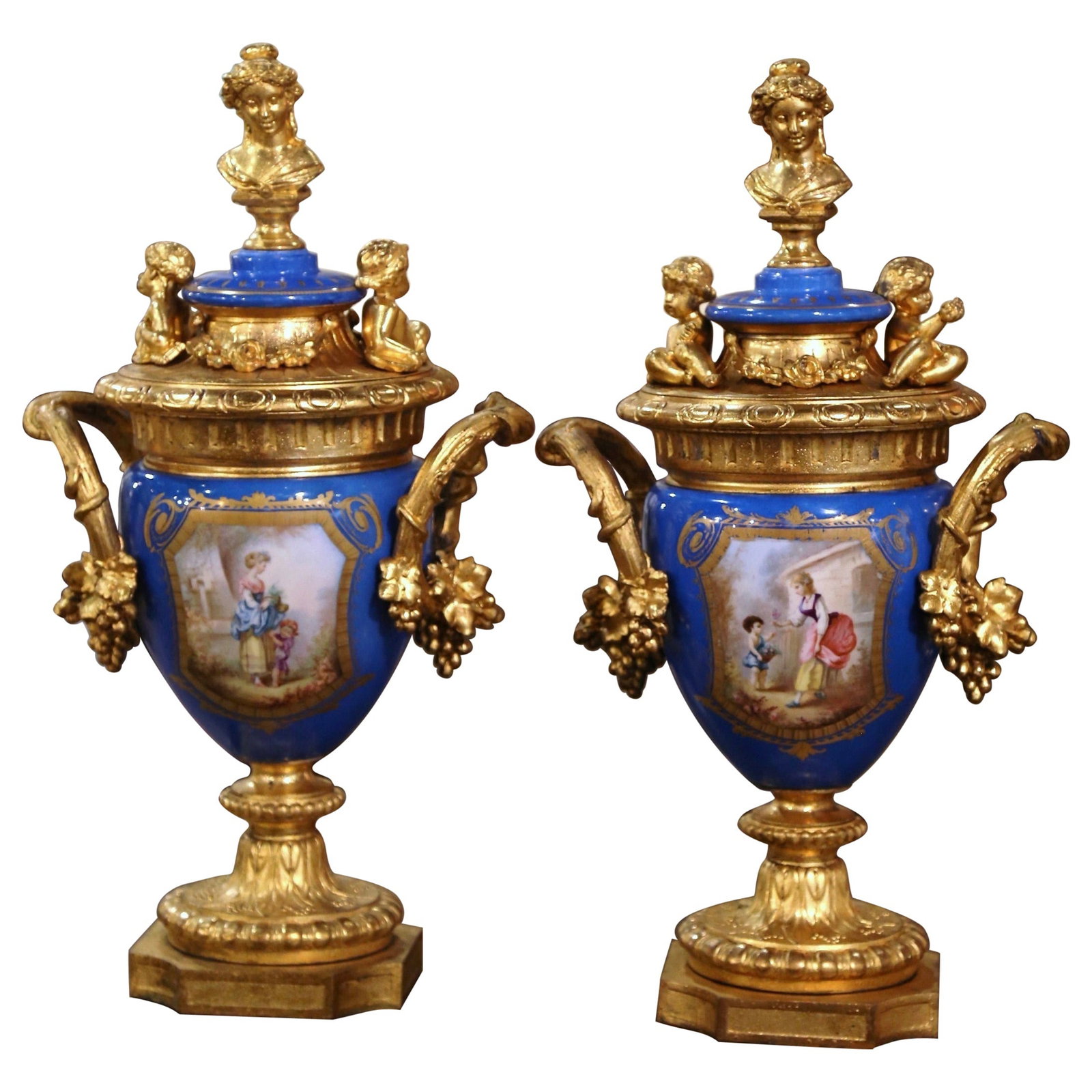 19th Century Sevres Urns Set of 2 Gilt Bronze Blue Porcelain Vases: 19th Century Sevres Urns Set of 2 Gilt Bronze Blue Porcelain Vases This exquisite pair of 19th Century French Sevres urns, crafted from blue porcelain and gilt bronze, is a stunning addition to any de