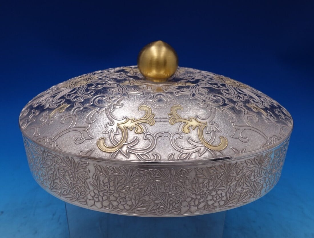 Korean .990 Silver Relish Dish with Chrysanthemum Motif and Gilt Finial: Korean .990 Silver Relish Dish with Chrysanthemum Motif and Gilt Finial This exquisite Korean relish dish is crafted from .990 silver, which is 99% pure silver, showcasing an elegant chrysanthemum mot