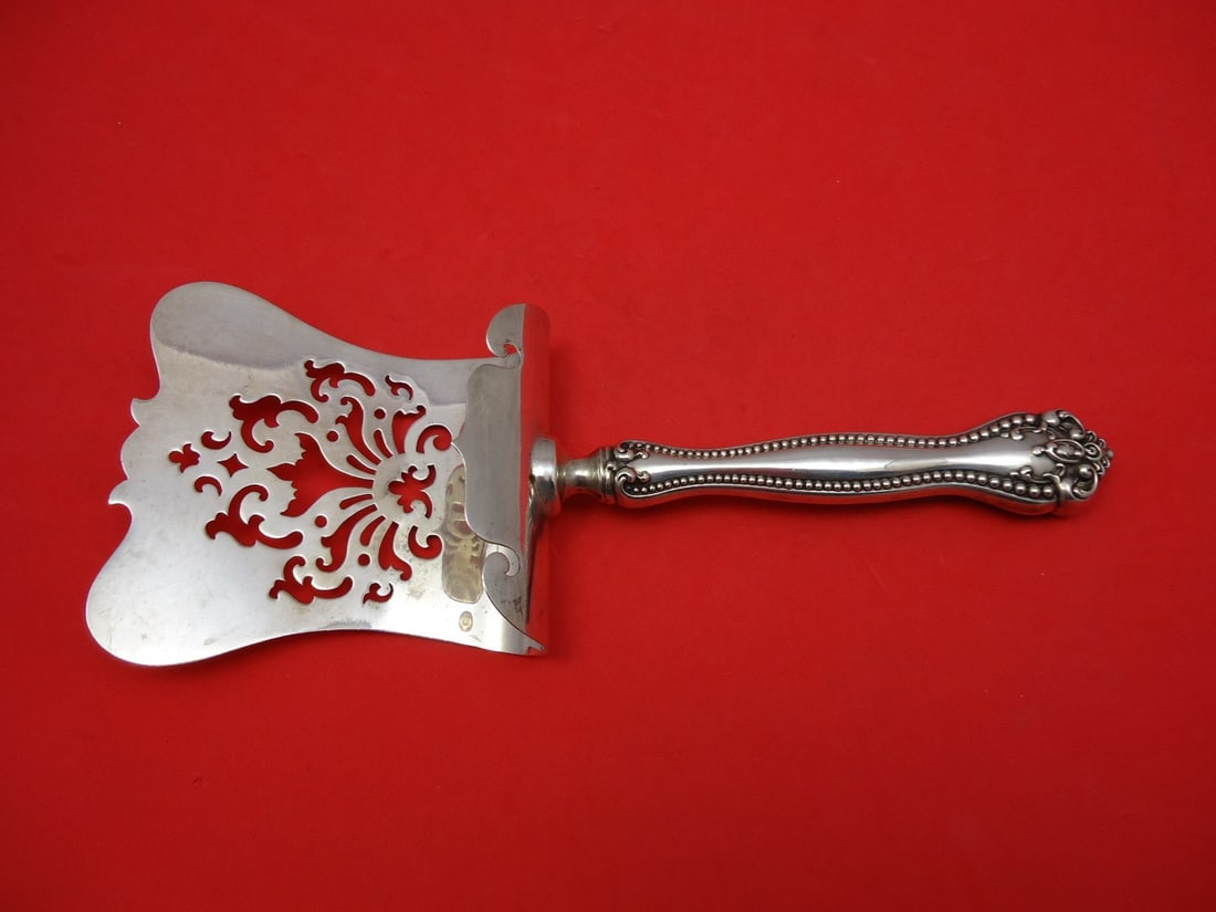 Alvin Raleigh Sterling Silver 10 Inch Asparagus Server Hand Pierced: Alvin Raleigh Sterling Silver 10 Inch Asparagus Server Hand Pierced This exquisite asparagus server, part of the Raleigh pattern by Alvin, is crafted from sterling silver and features a hand-pierced d