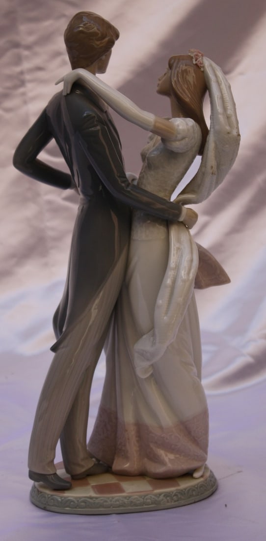 Lladro The First Wedding Dance Porcelain Figurine 14.5 Inches: Lladro The First Wedding Dance Porcelain Figurine 14.5 Inches Experience the elegance of love captured in porcelain with this magnificent Lladro figurine titled "The First Wedding Dance." This exquisi