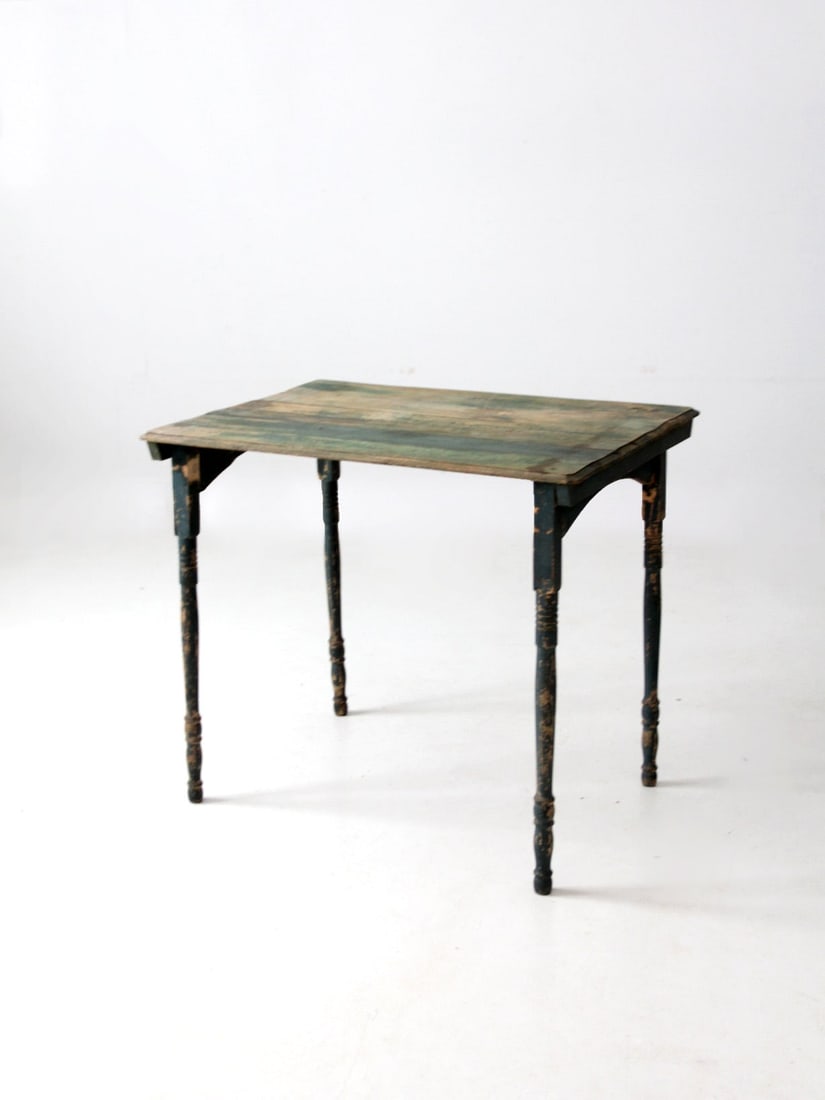 Green Painted Wood Folding Table with Turned Legs Antique Clipper Style: Green Painted Wood Folding Table with Turned Legs Antique Clipper Style This antique clipper style folding table features slender turned legs and gently arched aprons, complemented by a plank top with