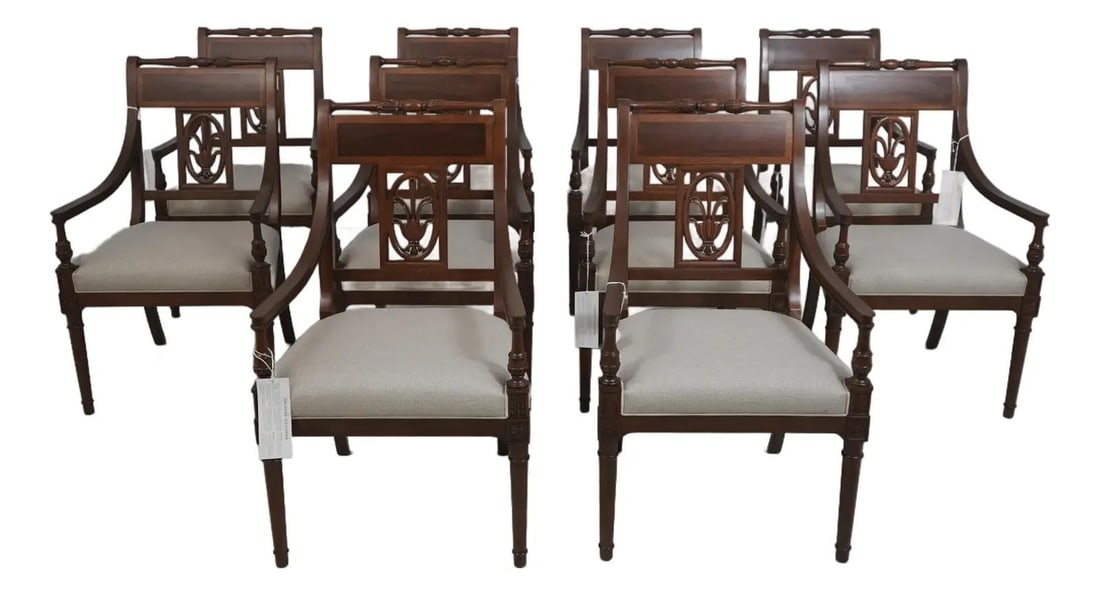 Set of 10 French Louis XVI Style Wood Dining Armchairs: Set of 10 French Louis XVI Style Wood Dining Armchairs This set includes 10 Theodore Alexander dining room armchairs crafted in the French Louis XVI style. Made from high-quality wood, each chair feat