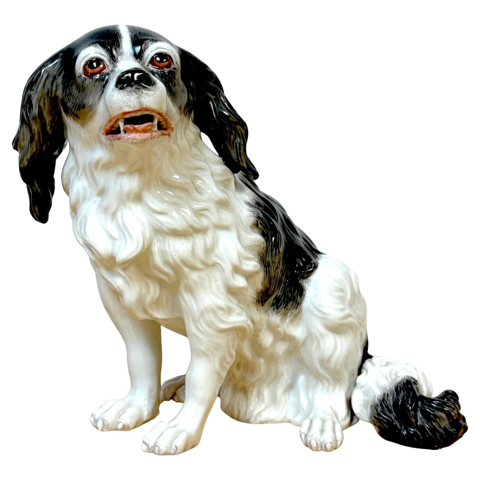 Antique Royal Vienna Porcelain King Charles Spaniel Figurine 1845: Antique Royal Vienna Porcelain King Charles Spaniel Figurine 1845 This exquisite 19th-century Vienna porcelain model of a King Charles Spaniel showcases the fine artistry of European porcelain craftsm