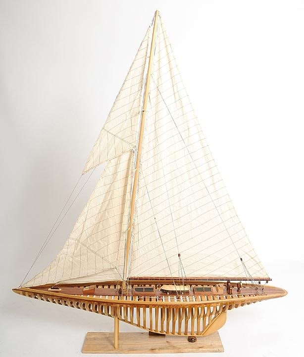 Handcrafted Classic Shamrock V Model Yacht in Western Red Cedar: Handcrafted Classic Shamrock V Model Yacht in Western Red Cedar Introducing the Handcrafted Classic Shamrock V Model Yacht, a stunning representation of nautical craftsmanship. This model is designed 