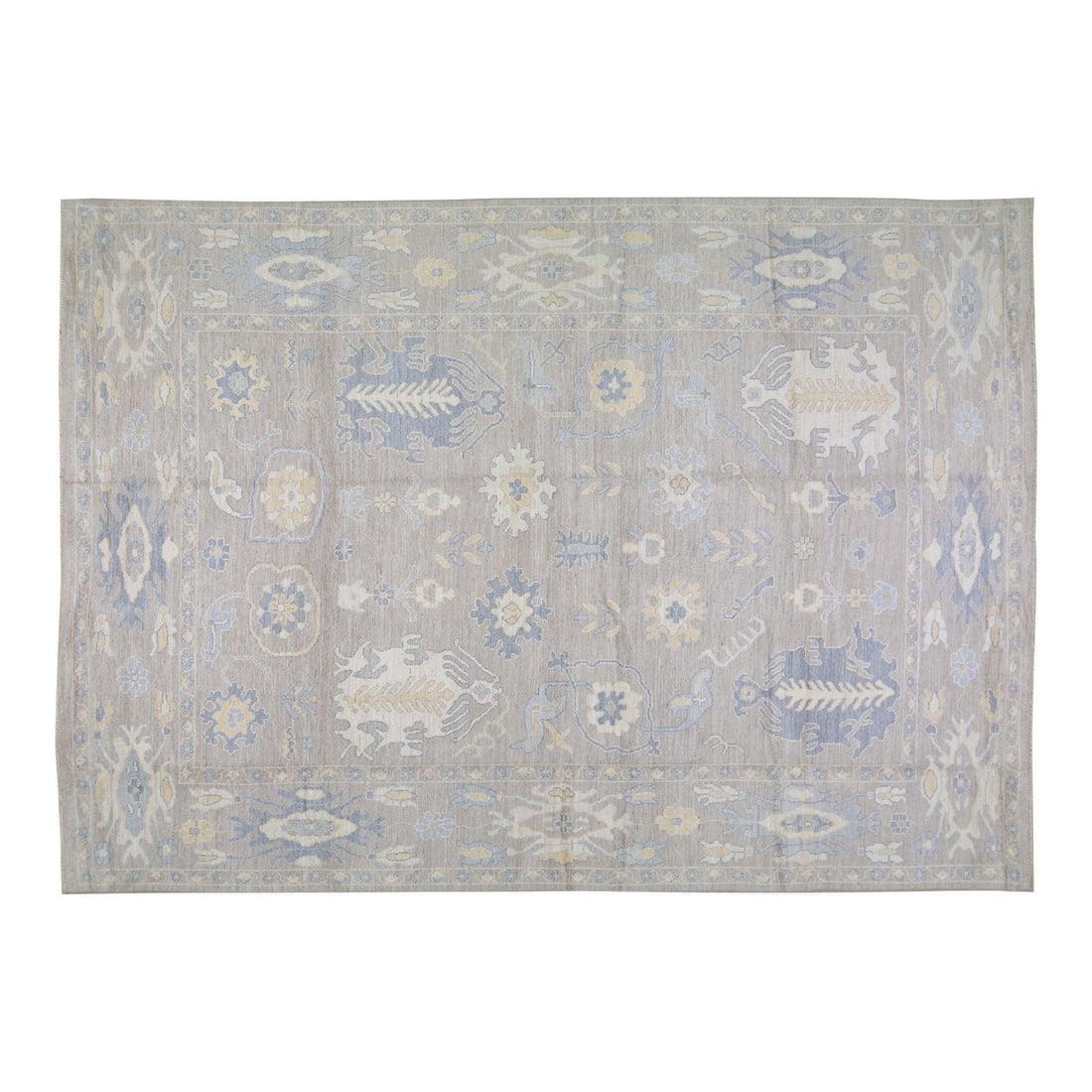 10'x14' Wool Area Rug in Turkish Oushak Style Hand Knotted: 10'x14' Wool Area Rug in Turkish Oushak Style Hand Knotted This Turkish Oushak rug is hand-knotted from wool using traditional techniques, offering a durable and richly textured surface. Its design ha