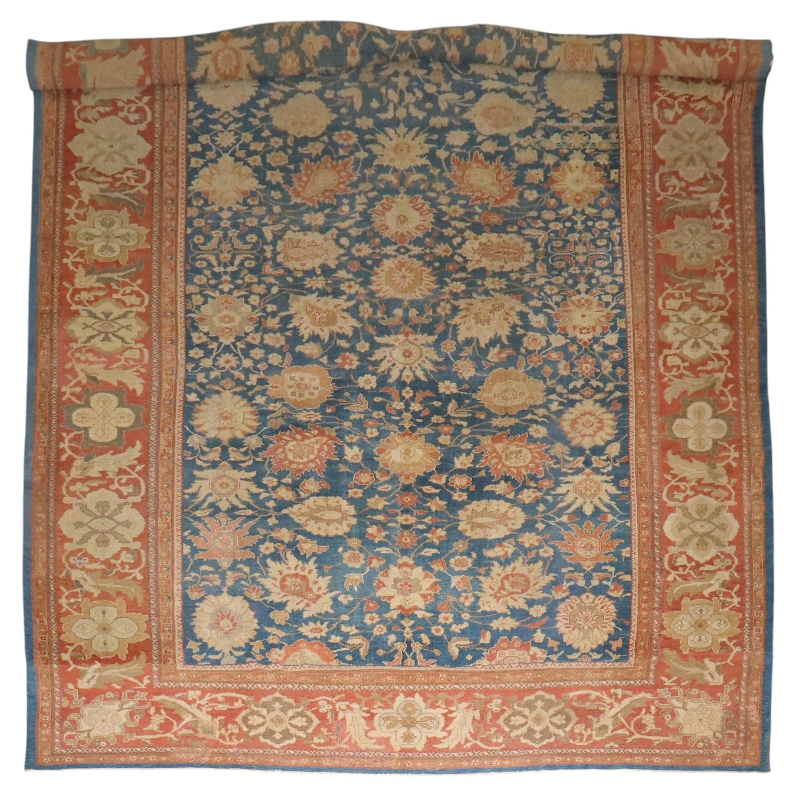 Oversize Handwoven Wool Sultanabad Rug Late 19th Century Iran: Oversize Handwoven Wool Sultanabad Rug Late 19th Century Iran This antique Ziegler Mahal Persian carpet from the late 19th century showcases a hand-woven wool construction in elegant blue and apricot 