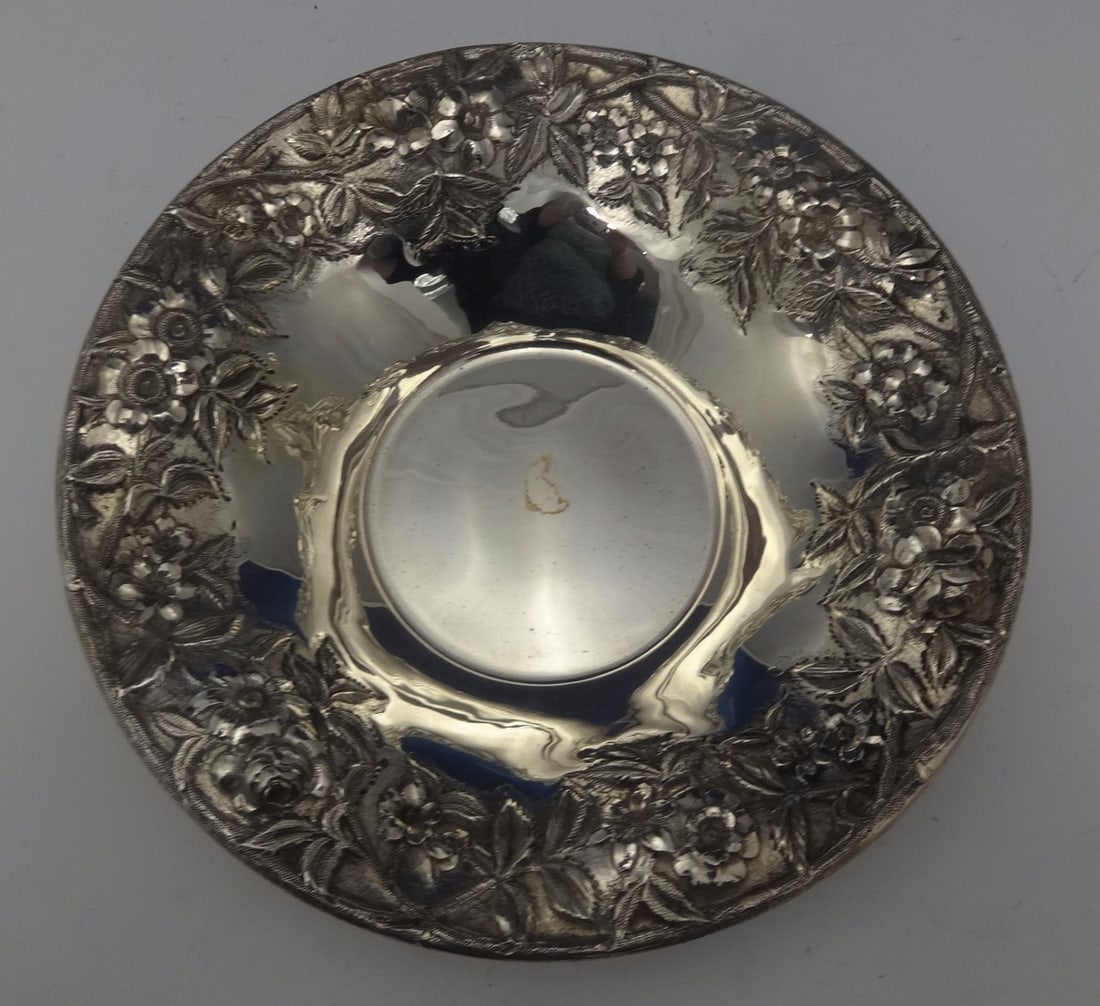 Kirk Sterling Silver Repousse Bowl 10 Diameter Floral Design: Kirk Sterling Silver Repousse Bowl 10 Diameter Floral Design This exquisite repousse bowl by Kirk is a stunning example of sterling silver craftsmanship. Measuring 10 inches in diameter and 2 inches t