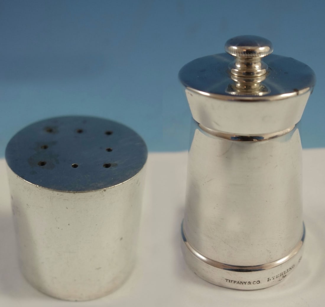 Tiffany & Co. Faneuil Sterling Silver Salt Shaker Pepper Mill Set: Tiffany & Co. Faneuil Sterling Silver Salt Shaker Pepper Mill Set Enhance your dining experience with this elegant Faneuil salt shaker and pepper mill set by Tiffany & Co. Crafted from high-quality st