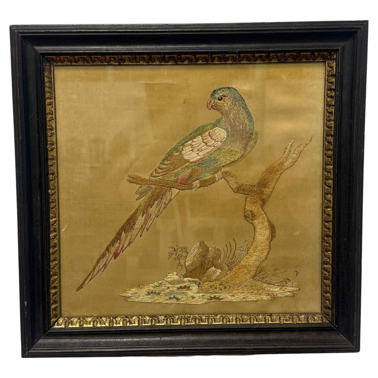 French Silk Needlework Parrot Panel in Giltwood Frame 19th Century: French Silk Needlework Parrot Panel in Giltwood Frame 19th Century This 19th-century Continental silk embroidery features a parrot perched in profile on a branch, rendered with intricate tonal shading