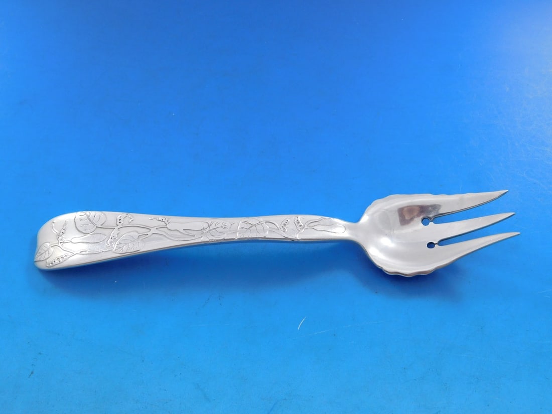 Tiffany & Co Sterling Silver 3-Tine Pastry Fork Lap Over Edge Gourd Motif: Tiffany & Co Sterling Silver 3-Tine Pastry Fork Lap Over Edge Gourd Motif This exquisite sterling silver pastry fork, crafted by Tiffany & Co., features the elegant Lap Over Edge pattern and a charmin