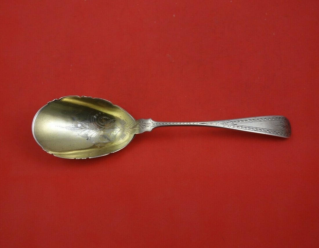 Bailey & Co Sterling Silver Gold Washed Berry Spoon 10 1/4 Inch: Bailey & Co Sterling Silver Gold Washed Berry Spoon 10 1/4 Inch This exquisite serving spoon by Bailey & Co. is crafted from sterling silver and features a gold wash with bright-cut detailing. Measuri