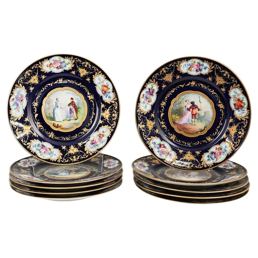 Set of 10 Epiag Cobalt Blue Gilt Porcelain Plates with Hand-Painted Scenes: Set of 10 Epiag Cobalt Blue Gilt Porcelain Plates with Hand-Painted Scenes This set features ten vintage porcelain cabinet plates by Epiag, crafted in the Czech Republic during the mid-20th century. E