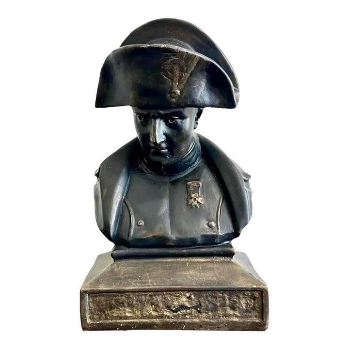 Bronze Tone Napoleon Military Bust Sculpture on Square Base: Bronze Tone Napoleon Military Bust Sculpture on Square Base This vintage mid 20th century bust features a commanding representation of Napoleon, crafted in a bronze-toned finish. The sculpture highlig