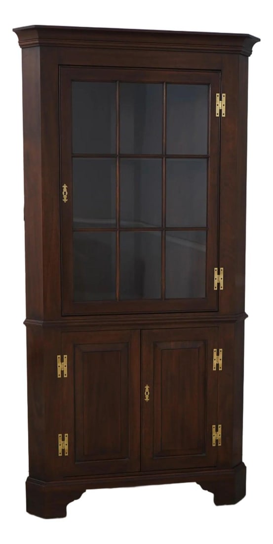Henkel Harris Mahogany Corner China Cabinet with Lighted Interior: Henkel Harris Mahogany Corner China Cabinet with Lighted Interior This Henkel Harris Mahogany Corner China Cabinet is a stunning piece, crafted around 1975, featuring high-quality construction and a b