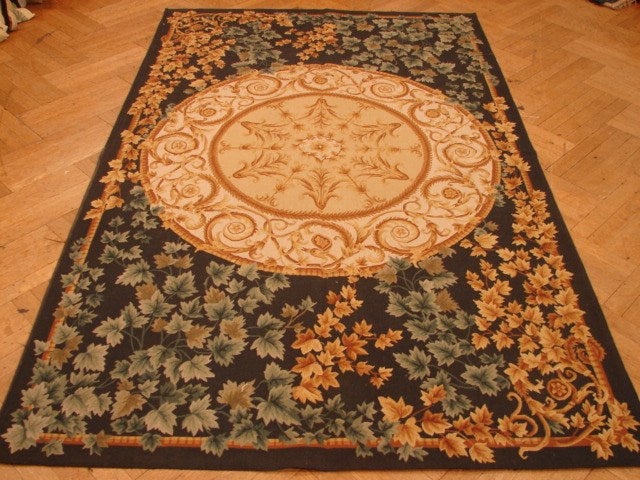 5' x 8' Hand-Knotted Black Aubusson Area Rug: 5' x 8' Hand-Knotted Black Aubusson Area Rug Free continental US Shipping Introducing the 5' x 8' Black Aubusson Rug, a striking piece that combines timeless elegance with classic sophistication. This