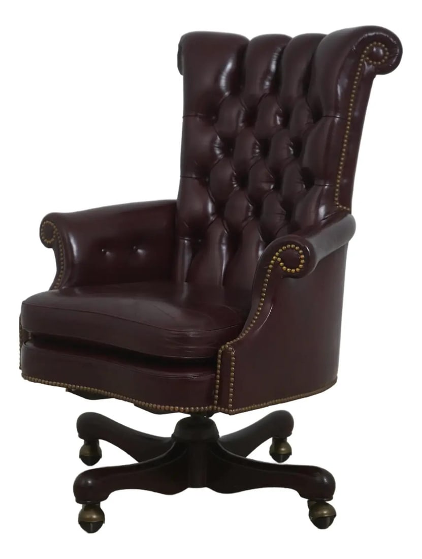 Burgundy Leather Mahogany Swivel Desk Chair with Brass Casters: Burgundy Leather Mahogany Swivel Desk Chair with Brass Casters This executive desk chair features burgundy tufted leather upholstery with a traditional design. It is constructed with a mahogany base a