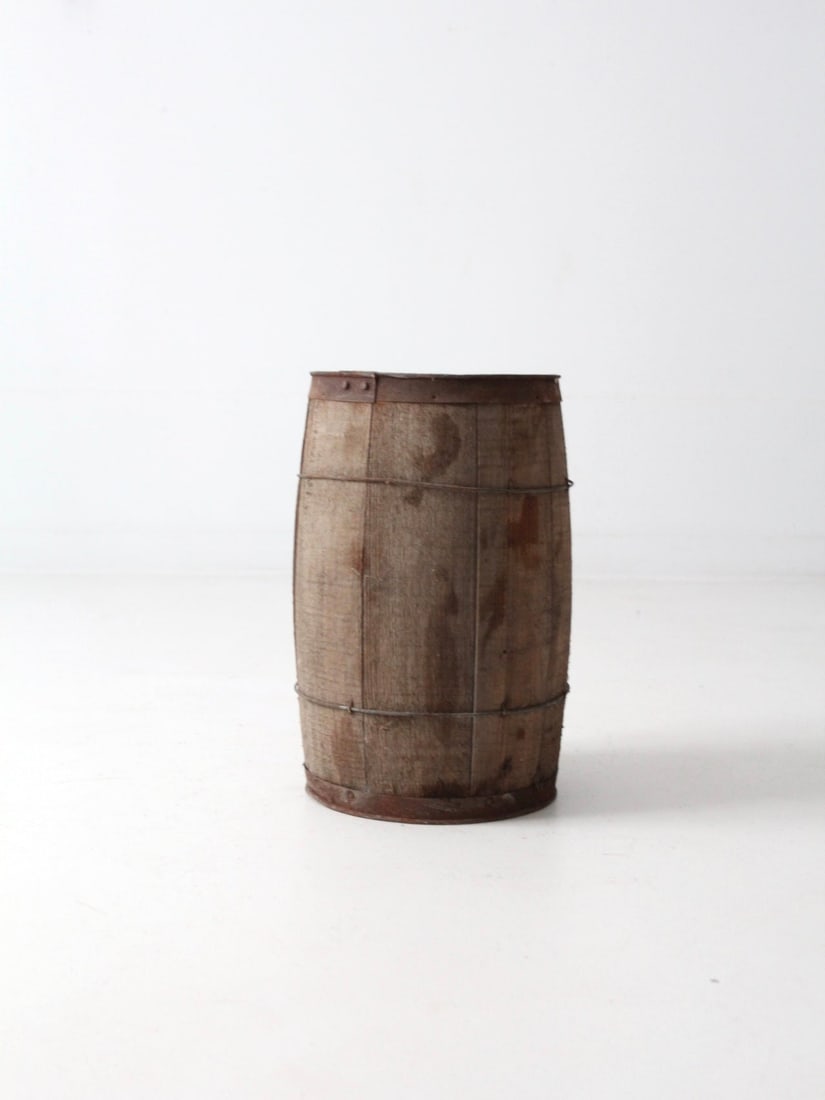 Rustic Antique Wooden Barrel with Metal Banding 18x11: Rustic Antique Wooden Barrel with Metal Banding 18x11 Explore the charm of this antique primitive wooden barrel, a striking piece that embodies rustic appeal. Crafted with sturdy wood slats and accent