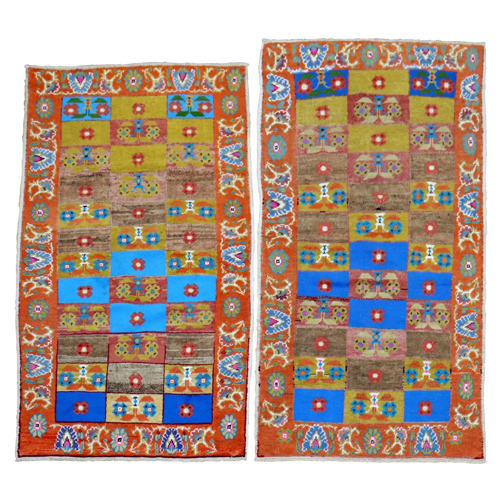 Pair of Mid-20th Century Turkish Wool Anatolian Rugs Set of 2: Pair of Mid-20th Century Turkish Wool Anatolian Rugs Set of 2 This pair of mid-20th century Turkish Anatolian rugs features bright, intense colors with a multi-color repetitive box design bordered by 