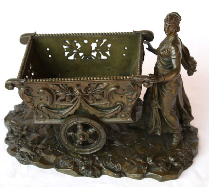19th Century French Art Nouveau Bronze Centerpiece Lady Cart: 19th Century French Art Nouveau Bronze Centerpiece Lady Cart Discover a stunning 19th century French Art Nouveau bronze centerpiece featuring a beautifully detailed depiction of a lady pushing a cart.
