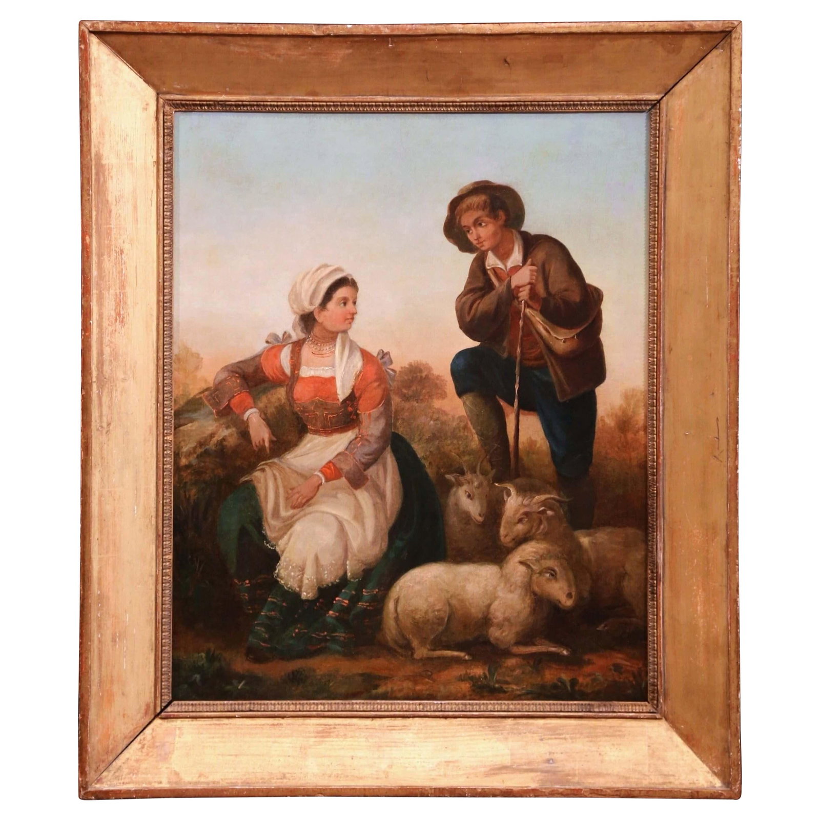 French Pastoral Oil Painting circa 1850 in Ornate Giltwood Frame: French Pastoral Oil Painting circa 1850 in Ornate Giltwood Frame This mid-19th century French oil on canvas painting features a romantic rural scene with a shepherd and a young woman conversing among 
