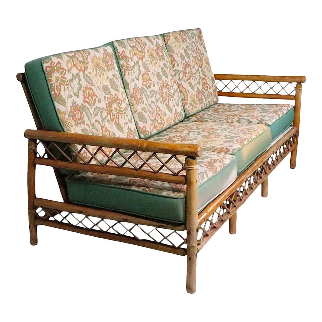 Three Seat Bamboo Sofa in the Style of Heywood Wakefield Mid Century: Three Seat Bamboo Sofa in the Style of Heywood Wakefield Mid Century This vintage mid-century three-seat bamboo sofa features decorative cross-hatched bamboo trim. The sturdy bamboo frame displays som