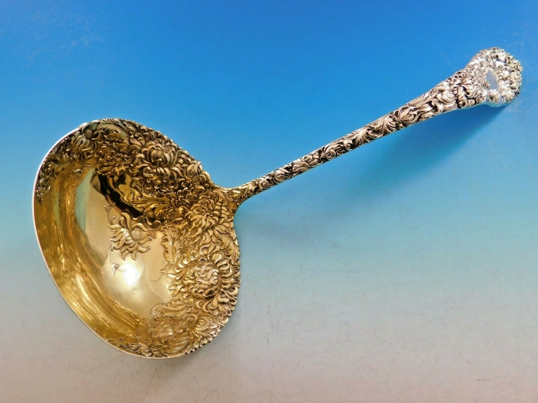 Durgin Chrysanthemum Sterling Silver 10 Inch Oyster Serving Ladle Gold Washed: Durgin Chrysanthemum Sterling Silver 10 Inch Oyster Serving Ladle Gold Washed This stunning serving ladle from Durgin's Chrysanthemum pattern is a beautiful addition to any collection. Crafted from st