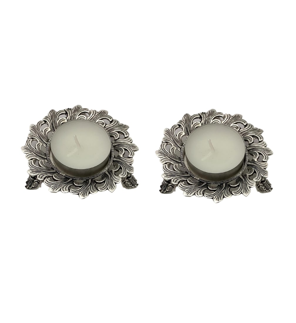 Handmade 925 Sterling Silver Leaf Chased Tea Light Holders: Handmade 925 Sterling Silver Leaf Chased Tea Light Holders Enhance your home decor with these exquisite handmade tea light candle holders crafted from fine 925 sterling silver. Featuring intricate lea