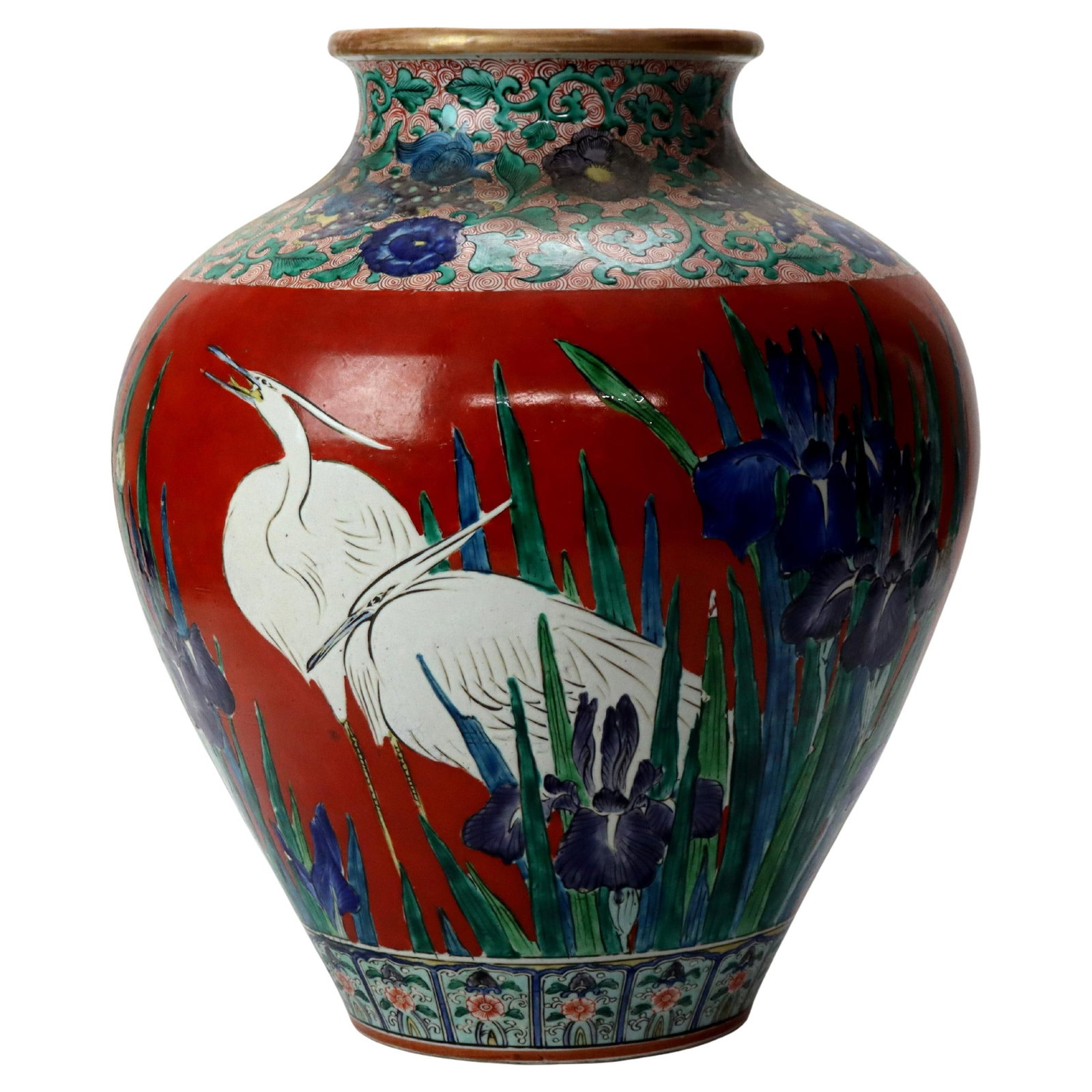 Meiji Period Japanese Pottery Vase with Heron and Floral Motifs Circa 1900: Meiji Period Japanese Pottery Vase with Heron and Floral Motifs Circa 1900 This antique Japanese vase from the Meiji period, circa 1900, is crafted from pottery and features a vibrant red background w