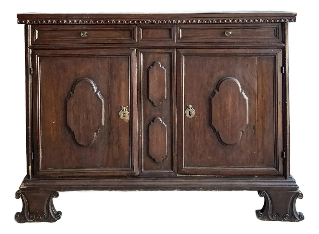 Hand-Carved Tuscan Walnut Buffet with Brass Hardware 18th Century Inspired: Hand-Carved Tuscan Walnut Buffet with Brass Hardware 18th Century Inspired This vintage Tuscan walnut buffet embodies the grandeur and rustic elegance of 18th-century European design. Expertly crafted