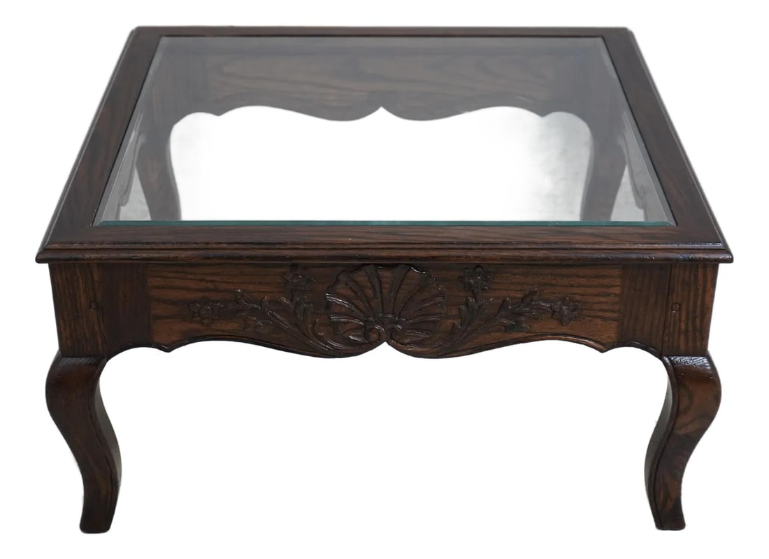 Country French Oak Coffee Table with Beveled Glass Top: Country French Oak Coffee Table with Beveled Glass Top This elegant Country French Oak Coffee Table features a stunning beveled glass top and showcases quality craftsmanship. With a traditional design