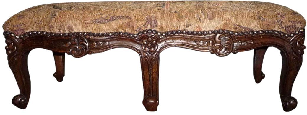 Carved Serpentine Footstool in Gold Upholstery Country French Style: Carved Serpentine Footstool in Gold Upholstery Country French Style Elevate your living space with this exquisite Carved Serpentine Gold Upholstered Footstool, designed in a charming Country French st