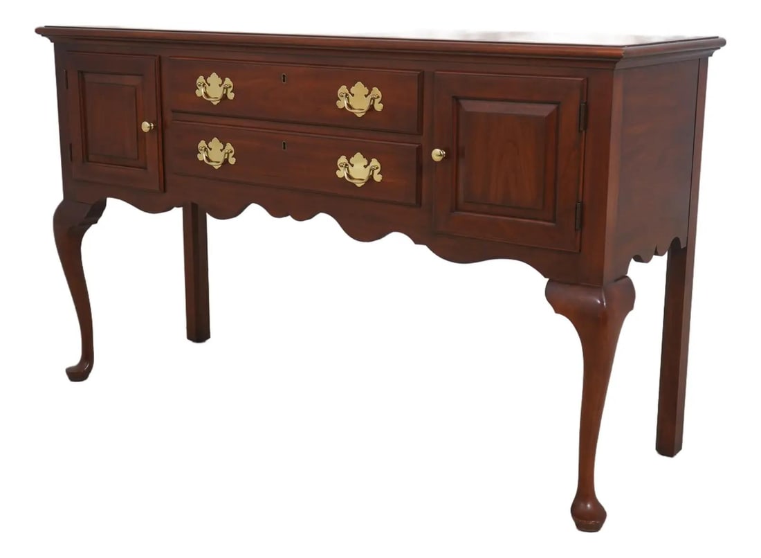 Queen Anne Cherry Wood Sideboard Model 2358 with Brass Hardware: Queen Anne Cherry Wood Sideboard Model 2358 with Brass Hardware This Henkel Harris Model 2358 sideboard features solid cherry wood construction with a traditional design. It includes dovetailed drawer